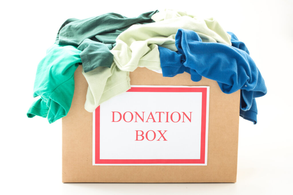 Cardboard donation box with clothes